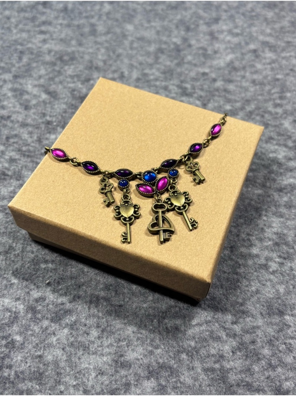 Vintage-Inspired Key Charm Necklace with Pink and Blue Accents
